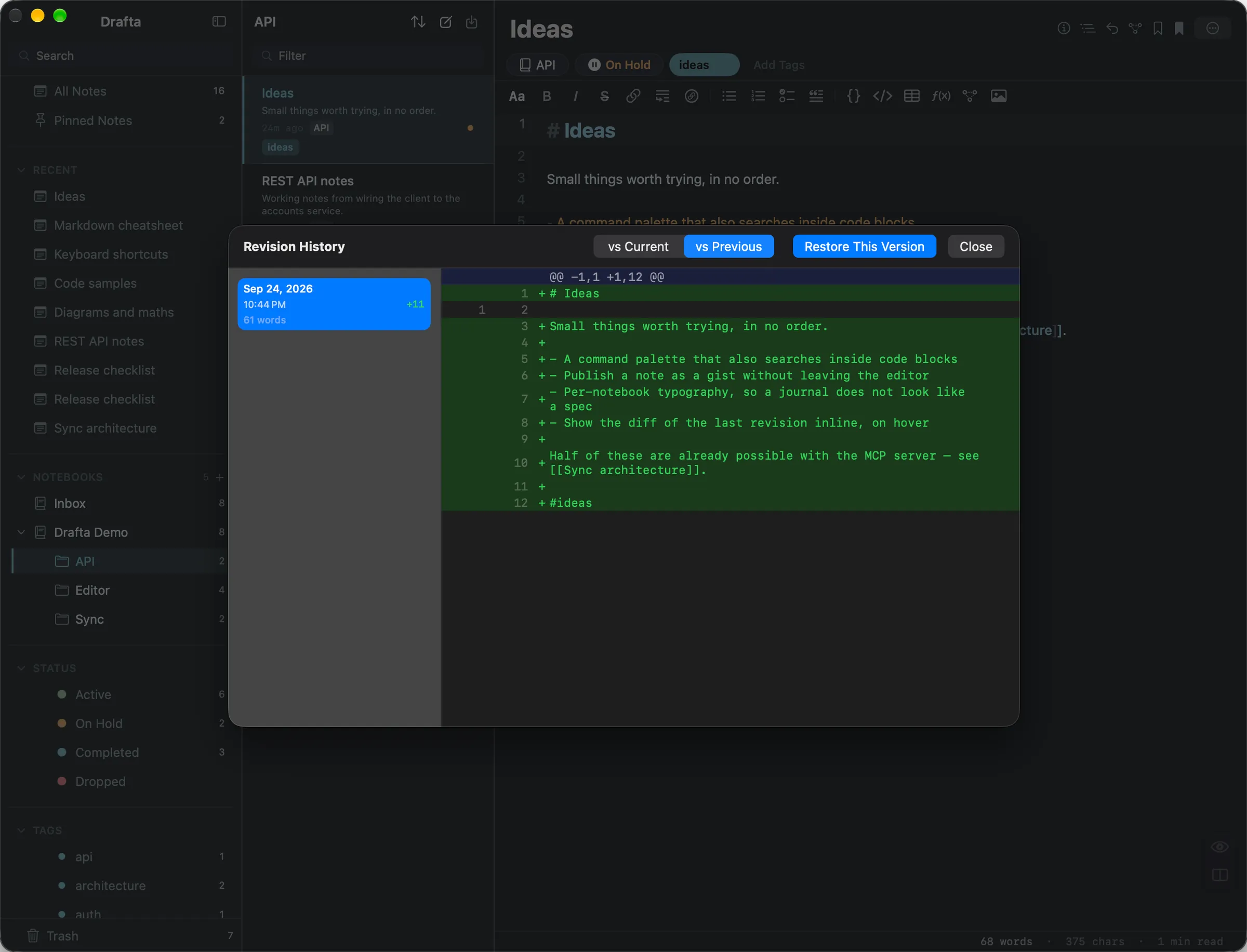 Drafta’s Revision History window: a saved revision on the left and its unified diff against the previous version on the right, with Restore This Version.